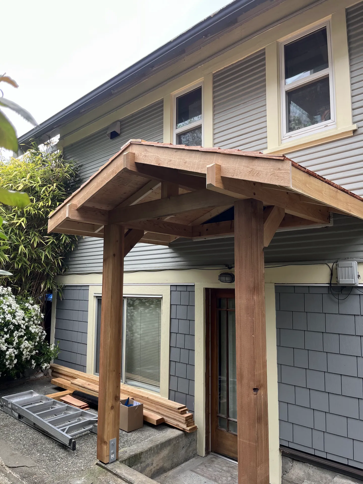 Timber frame cedar portico over a home entrance