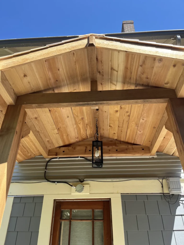 Cedar portico ceiling with exposed rafters